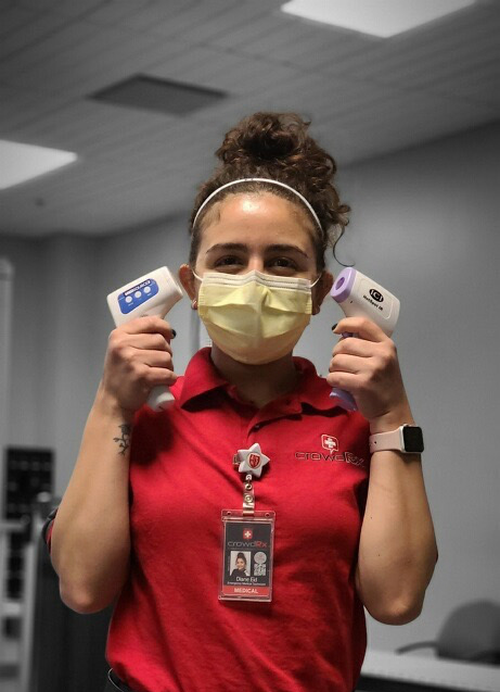 Set Medic holding thermometers