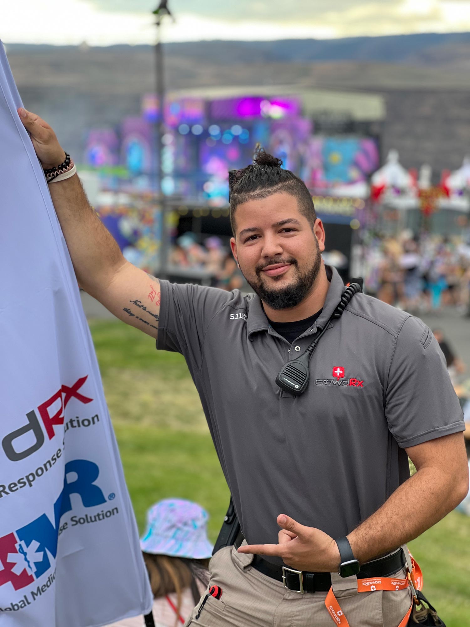 Staff member posing at a festival