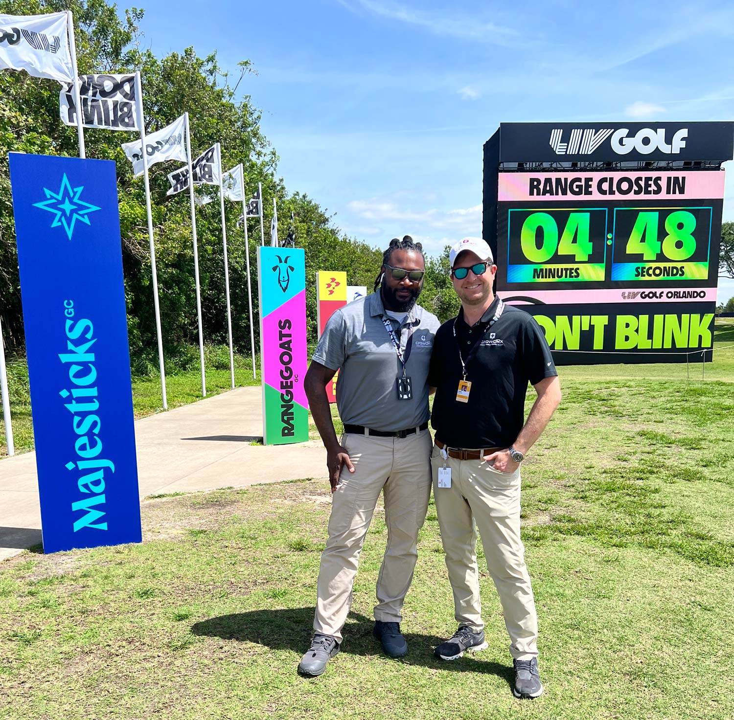 2 staff members shown at Liv Golf event